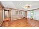 Bright living area with hardwood floors, large windows, and a partial view into the entry hall at 346 Buckingham Sw Dr, Conyers, GA 30094