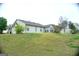 Expansive backyard features a large lot with mature trees surrounding this charming home at 329 Harris Ave, Locust Grove, GA 30248