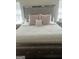 Comfortable bedroom with large bed and neutral decor at 329 Harris Ave, Locust Grove, GA 30248