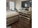 Mirrored dresser and decor inside neutrally decorated bedroom at 329 Harris Ave, Locust Grove, GA 30248