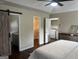 Bedroom featuring bathroom, laundry, and closet access at 329 Harris Ave, Locust Grove, GA 30248