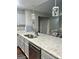 Well-equipped kitchen featuring granite countertops and stainless steel appliances at 329 Harris Ave, Locust Grove, GA 30248