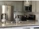 Stylish kitchen with granite countertops, stainless appliances, and ample cabinet space at 329 Harris Ave, Locust Grove, GA 30248