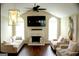 Bright living room with vaulted ceilings, a cozy fireplace, and stylish decor at 329 Harris Ave, Locust Grove, GA 30248