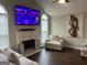 Inviting living room features vaulted ceilings, fireplace, large television at 329 Harris Ave, Locust Grove, GA 30248