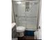 Modern bathroom features a glass door shower stall, a toilet and a granite vanity at 329 Harris Ave, Locust Grove, GA 30248