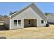 Back view of home featuring an open porch area and large windows, great for natural light at 553 Cantrell Drive, Dallas, GA 30157