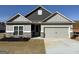 Charming single-story home with a two-car garage and professionally landscaped front yard at 553 Cantrell Drive, Dallas, GA 30157