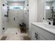 Beautiful bathroom with a glass shower door, white vanity, sleek fixtures, and marbled tile at 807 Stickley Oak Way, Woodstock, GA 30189