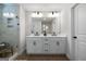 Stylish bathroom featuring double sink vanity, modern fixtures, large mirror and glass shower door at 807 Stickley Oak Way, Woodstock, GA 30189