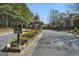 Beautiful community entrance with landscaped flower beds, signage and a secure gate at 807 Stickley Oak Way, Woodstock, GA 30189