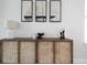 Stylish sideboard with decor and artwork, showcasing modern interior design elements at 807 Stickley Oak Way, Woodstock, GA 30189