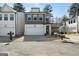 Charming two-story home with a two-car garage and modern architectural details in a suburban neighborhood at 807 Stickley Oak Way, Woodstock, GA 30189