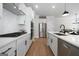 Well-equipped kitchen with stainless steel appliances, quartz countertops and ample cabinet space at 807 Stickley Oak Way, Woodstock, GA 30189