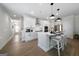 Bright, open kitchen with a large island, stainless steel appliances, and modern finishes at 807 Stickley Oak Way, Woodstock, GA 30189