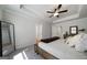Spacious main bedroom featuring neutral colors, tray ceiling, ceiling fan, carpet, and a mirror for added depth at 807 Stickley Oak Way, Woodstock, GA 30189