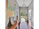 Spacious front entryway with wood floors and views of the front yard through the front door at 147 Kripple Kreek Dr, Sharpsburg, GA 30277