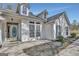 Close up view of front entrance with charming door and meticulously manicured landscaping at 147 Kripple Kreek Dr, Sharpsburg, GA 30277