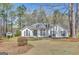 Charming one-story white home with dormer windows and a well-manicured front yard at 147 Kripple Kreek Dr, Sharpsburg, GA 30277