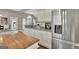 Contemporary kitchen with stainless steel refrigerator and granite countertops at 147 Kripple Kreek Dr, Sharpsburg, GA 30277