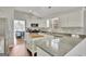 Updated kitchen with white cabinetry, a center island, and stainless steel appliances at 147 Kripple Kreek Dr, Sharpsburg, GA 30277