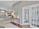 Elegant entry foyer flows into a cozy living area featuring neutral tones and an open layout at 147 Kripple Kreek Dr, Sharpsburg, GA 30277