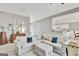 Open-concept living room with gray walls and a large sectional sofa at 147 Kripple Kreek Dr, Sharpsburg, GA 30277