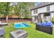 The backyard boasts an in-ground pool, fire pit, outdoor seating, and landscaped turf at 3144 Sherwood Oaks Ln, Decatur, GA 30034