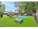 Entertainer's backyard with in-ground pool, outdoor seating, and modern fire pit at 3144 Sherwood Oaks Ln, Decatur, GA 30034
