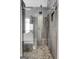 Beautiful bathroom featuring a glass-enclosed shower with pebble floor, neutral tile, and modern fixtures at 3144 Sherwood Oaks Ln, Decatur, GA 30034