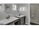 Stylish bathroom features double sinks, oval mirrors, modern lighting, and glass shower at 3144 Sherwood Oaks Ln, Decatur, GA 30034