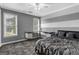 Comfortable bedroom with large windows, painted accent wall, and desk at 3144 Sherwood Oaks Ln, Decatur, GA 30034