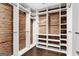 Spacious walk-in closet with custom shelving and wood paneling offering ample storage at 3144 Sherwood Oaks Ln, Decatur, GA 30034