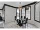 Bright dining room with large windows and modern lighting, showcasing elegant decor and seating for four at 3144 Sherwood Oaks Ln, Decatur, GA 30034