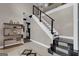 Open foyer featuring an elegant staircase and custom shelving, creating a welcoming space and architectural interest at 3144 Sherwood Oaks Ln, Decatur, GA 30034
