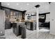 Stylish kitchen with dark cabinetry, granite countertops, stainless steel appliances, and open layout to the living area at 3144 Sherwood Oaks Ln, Decatur, GA 30034