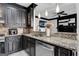 View of the kitchen area featuring granite countertops, stainless steel appliances, and modern fixtures, with open floor plan at 3144 Sherwood Oaks Ln, Decatur, GA 30034