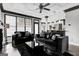 Inviting living room with modern black decor, recessed ceiling, and plentiful natural light from large windows at 3144 Sherwood Oaks Ln, Decatur, GA 30034