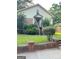 Modest home featuring a classic design and a well-maintained lawn with mature landscaping at 466 Joseph E Lowery Nw Blvd, Atlanta, GA 30314