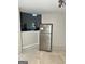 Kitchen area featuring a stainless steel refrigerator and a pass through into an adjacent living room at 466 Joseph E Lowery Nw Blvd, Atlanta, GA 30314