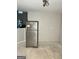 Kitchen area featuring a stainless steel refrigerator and a pass through into an adjacent living room at 466 Joseph E Lowery Nw Blvd, Atlanta, GA 30314