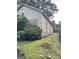 Exterior view showcasing the home's side, highlighted by a green lawn at 466 Joseph E Lowery Nw Blvd, Atlanta, GA 30314