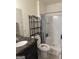Bathroom featuring vanity with marble countertop, modern fixtures, toilet and stand up shower at 2791 Biscayne Dr, Conyers, GA 30012