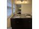 Bathroom featuring a double vanity with marble countertop and modern fixtures at 2791 Biscayne Dr, Conyers, GA 30012