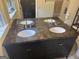 Bathroom featuring a double vanity with marble countertop and modern fixtures at 2791 Biscayne Dr, Conyers, GA 30012