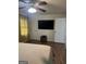 Bedroom featuring a ceiling fan, television, and warm-toned walls that create an inviting living space at 2791 Biscayne Dr, Conyers, GA 30012