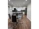 Open dining area with modern table and chairs adjacent to an updated kitchen at 2791 Biscayne Dr, Conyers, GA 30012