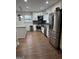 Updated kitchen with stainless steel appliances, white cabinets, and a stylish island at 2791 Biscayne Dr, Conyers, GA 30012