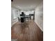 Updated kitchen open to the dining area featuring white cabinetry and modern appliances at 2791 Biscayne Dr, Conyers, GA 30012
