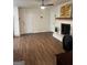 The open-concept living room boasts fireplace and hardwood floors at 2791 Biscayne Dr, Conyers, GA 30012